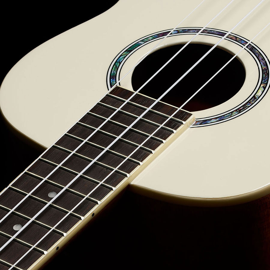 Close-up view of Córdoba 15C Mallorcan Pearl ukulele neck thumb