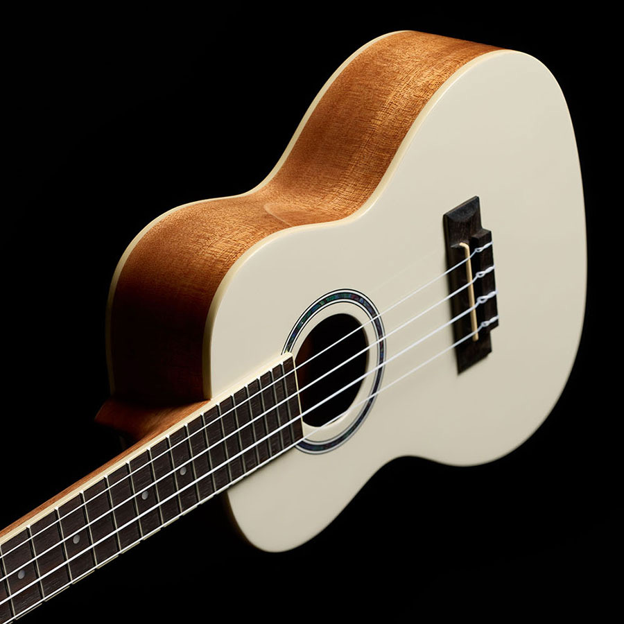 Angled side view of Córdoba 15C Mallorcan Pearl ukulele thumb