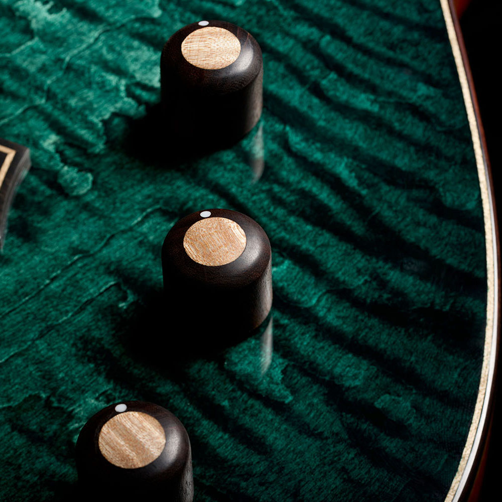 Close-up of Stage Artist Agave Burst knobs thumb