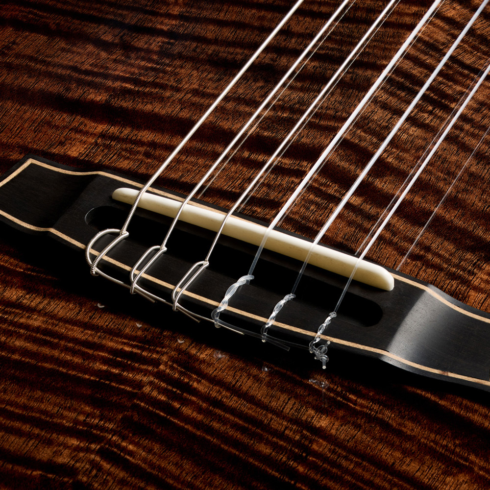 Close-up view of Stage Artist Habano Burst bridge thumb