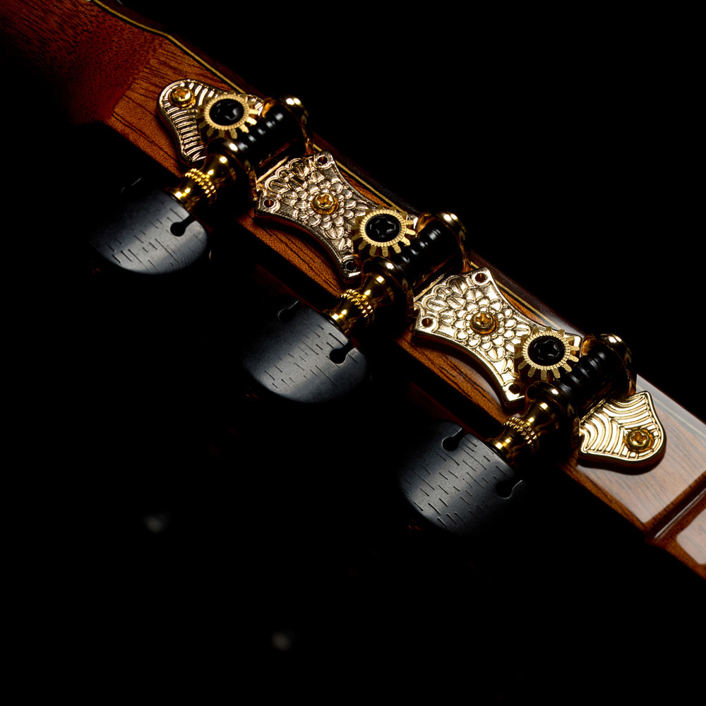 Close-up view of Stage Artist Traditional headstock featuring Córdoba Flower Petal tuners thumb