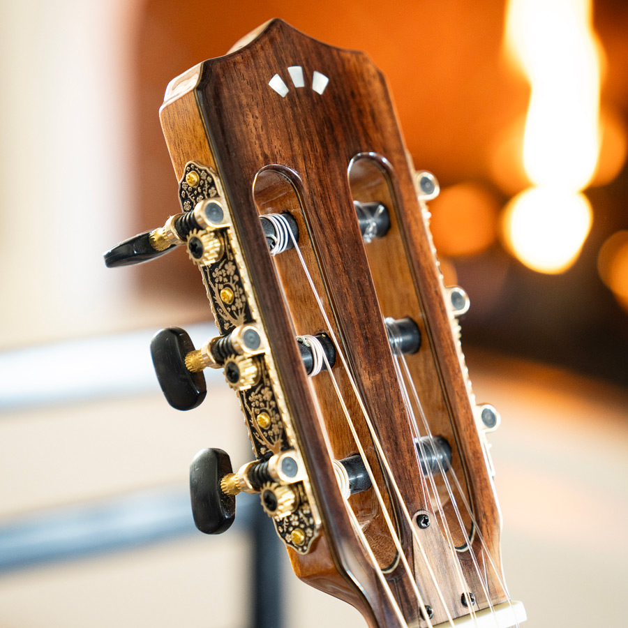 Close-up of Stage Edge Burst headstock thumb