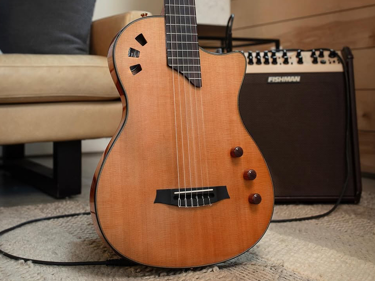 View of the Stage Traditional CD body in front of a chair and amp in a living room