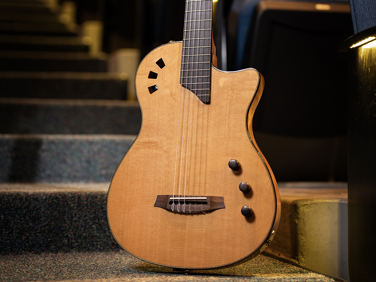 View of the Stage Traditional CD body leaning against chairs in an auditorium