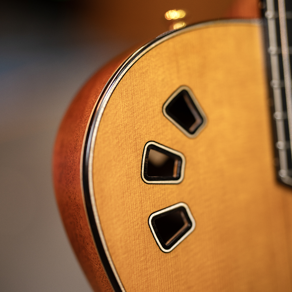 Close-up of Córdoba Stage Artist Traditional showcasing the solid cedar top and soundhole