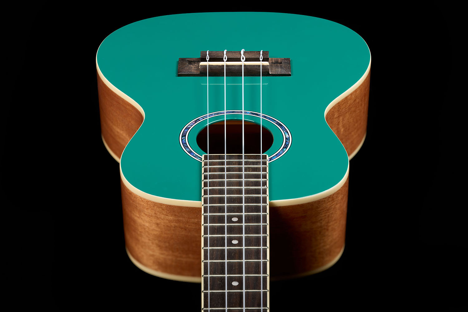 Looking down the neck  at the front body of Córdoba 15C Catalonia Green ukulele