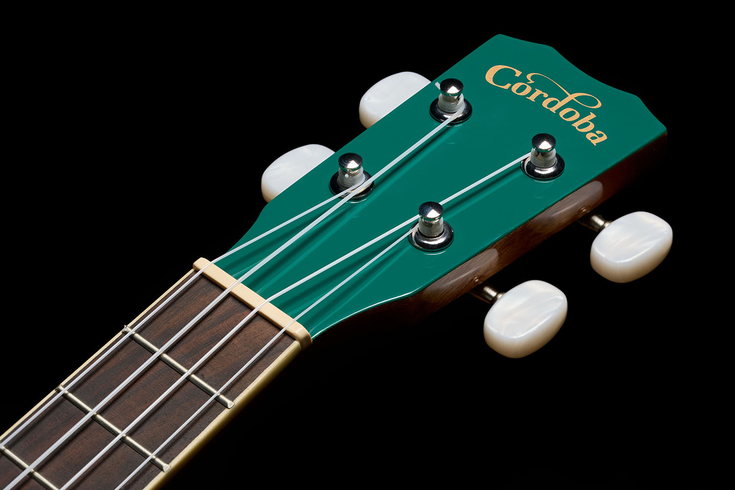 Close-up front of the headstock of Córdoba 15C Catalonia Green ukulele