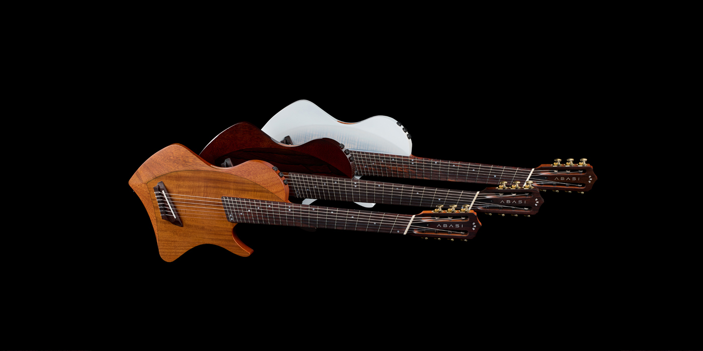 All three Abasi 7 guitars horizontally stacked on a black background